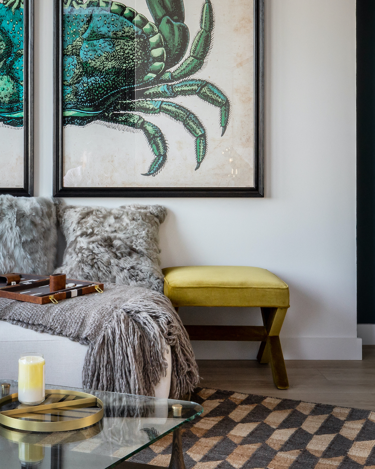 a living room with a couch and a table and pictures on the wall
