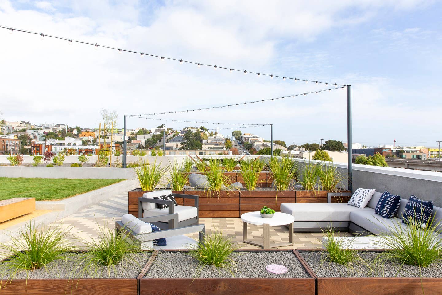 a roof terrace with a couch and a table