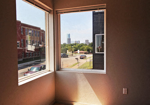 a large window with a view of a city