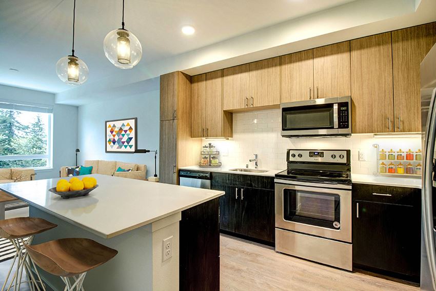 a kitchen with a center island and a stove