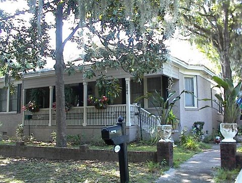 a house with a porch and a parking meter