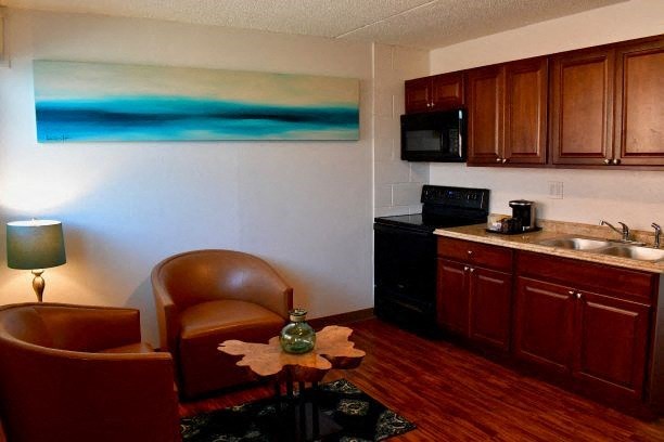 a kitchen and living room with a table and chairs