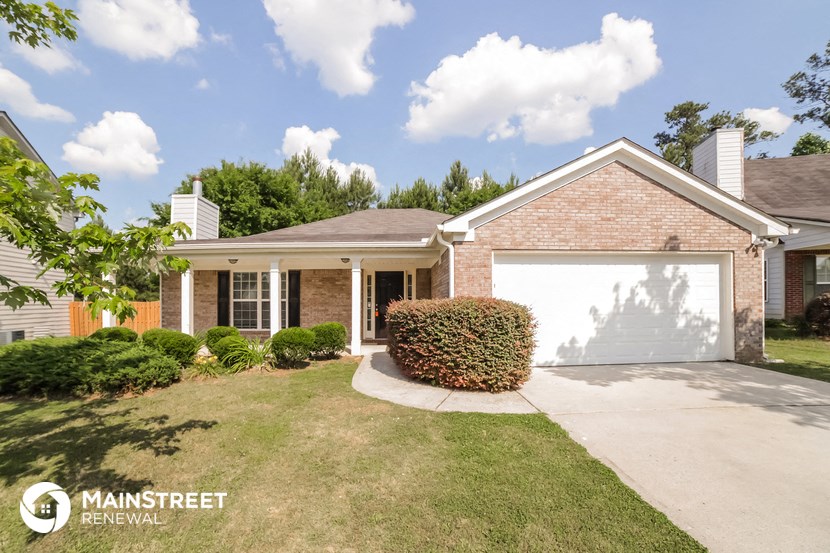 a house with a driveway and a garage door