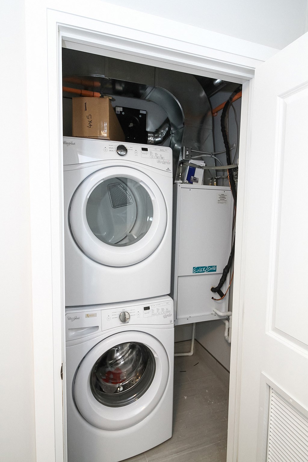 a washing machine and a dryer in a closet