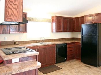 Refrigerator in Kitchen at Maple Grove Rental Home Community in Lincoln, NE