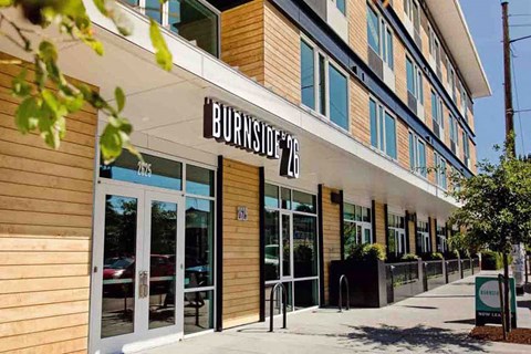 The image shows the front of a building named Burnside with a clear sky in the background.