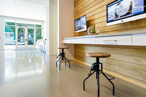 A room with a wooden wall and a glass door.