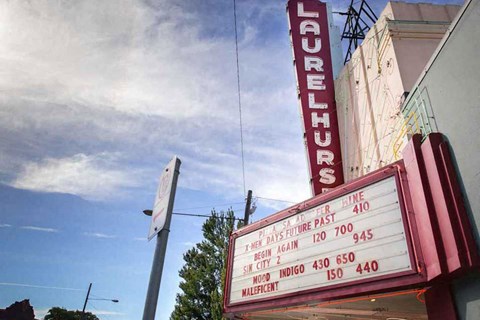 A Laurelhurst sign is displayed on a building.