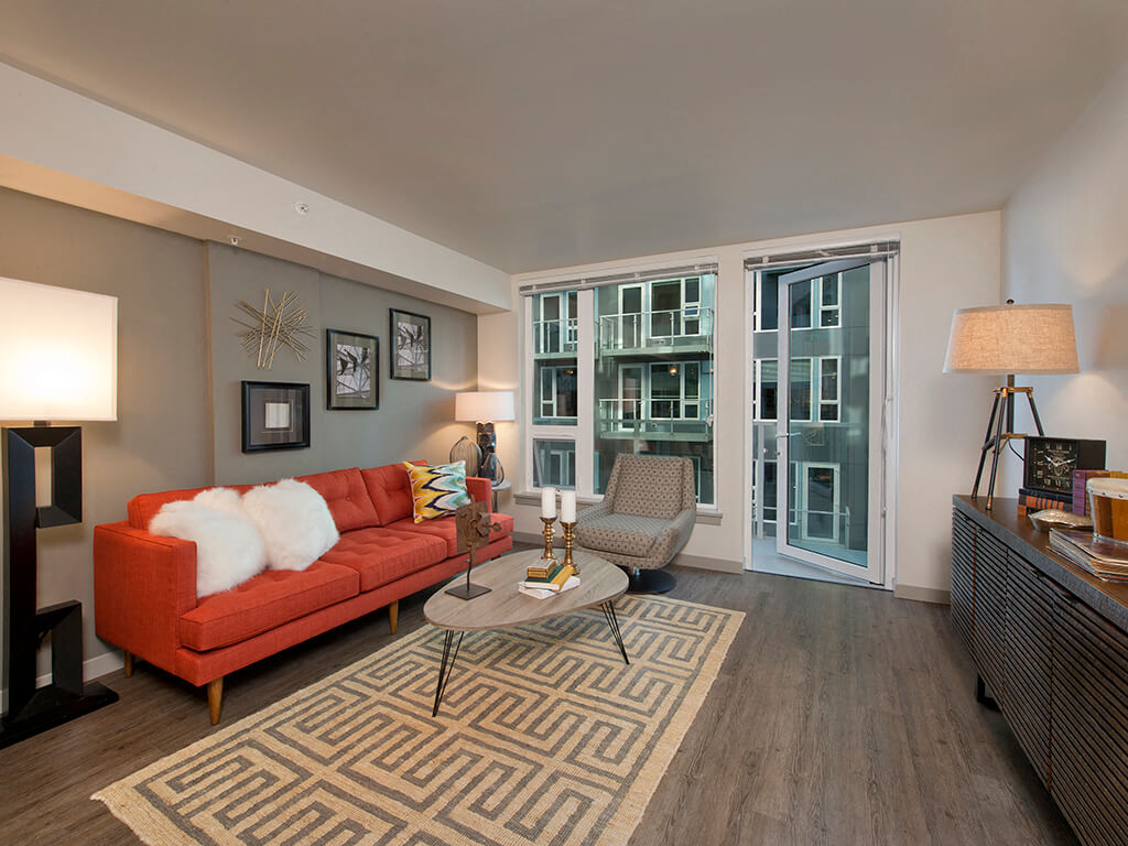 Living room with walk out patio at Infinity Apartments in Seattle WA