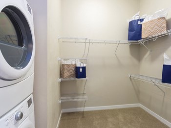 Laundry Room with Washer and Dryer at The Douglas Apartments in Denver - Photo Gallery 6