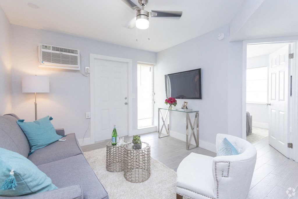 a living room with a couch and a tv