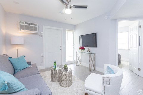 a living room with a couch and a tv