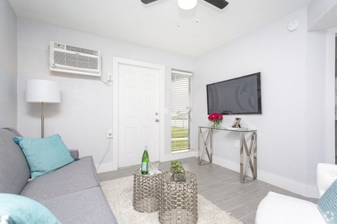 a living room with a couch and a tv