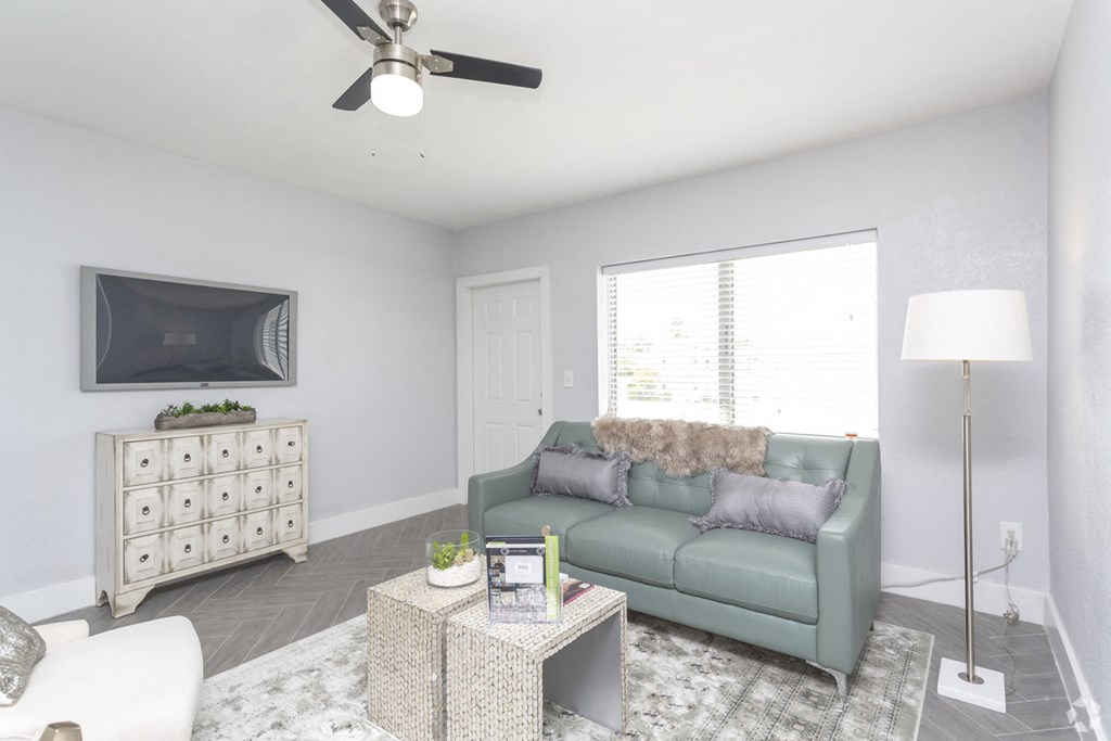 a living room with a couch and a tv