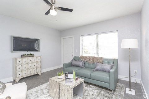 a living room with a couch and a tv