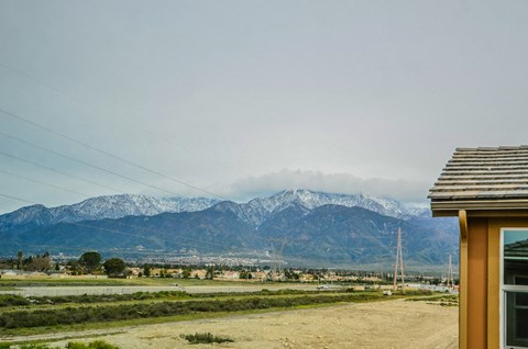 a view of the mountains in the distance from a house