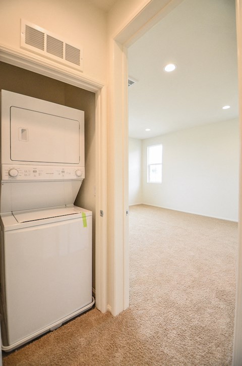 a laundry room with a washer and dryer in it