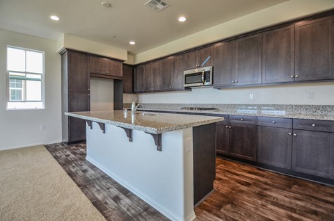 a kitchen with an island in the middle