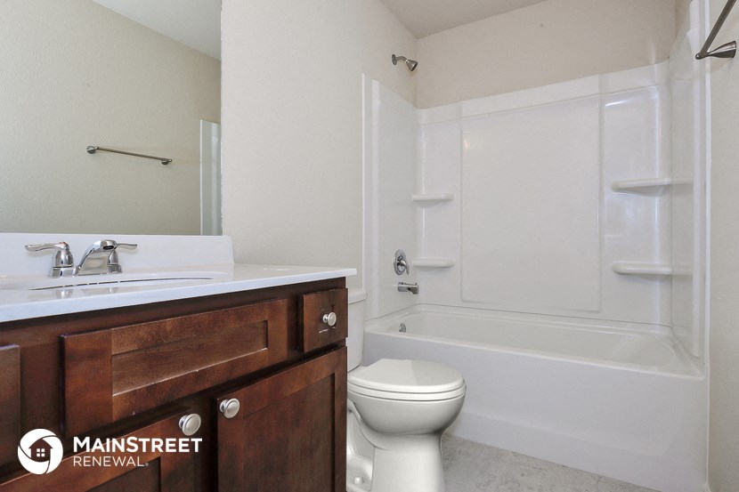 a bathroom with a sink toilet and a tub