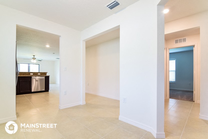 the living room and kitchen are open to the dining room