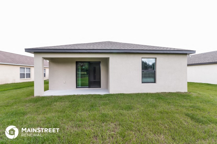 a small house with a lawn in front of it