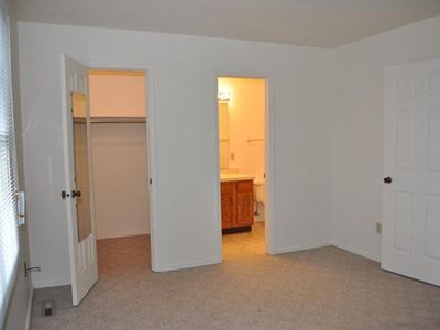 Bedroom facing closet and bathroom