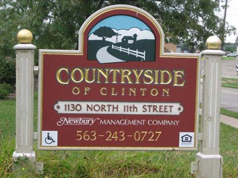 a sign for the county on the side of a road