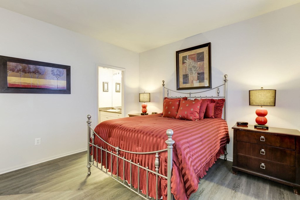 a bedroom with a bed and a dresser