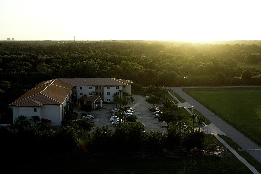 aerial view of St. John XXIII Villas surrounded by lush trees