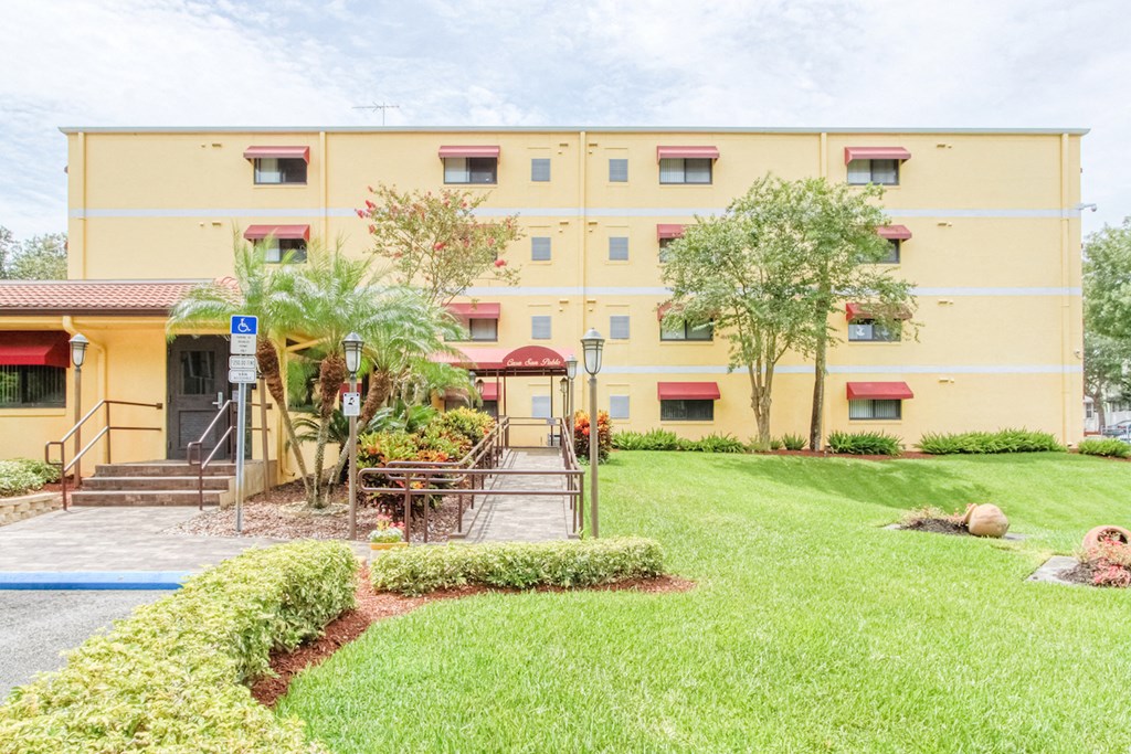 Neat landscaping and well-kept exterior at Casa San Pablo Senior Apartments