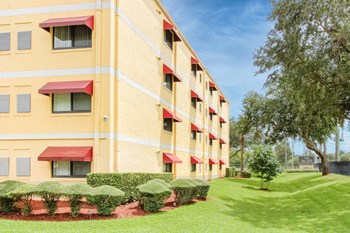 CasaSanPablo-Outside2 Casa San Pablo senior apartments exterior with mature trees and trim grass - Photo Gallery 3