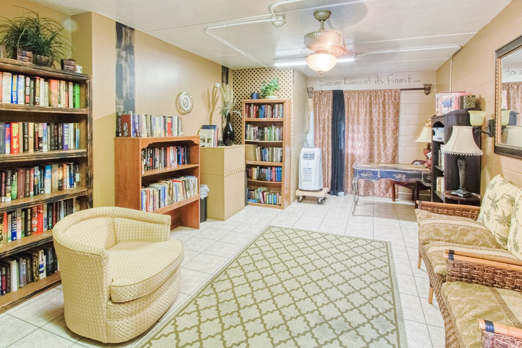 large library with comfortable chairs and plenty of books to read at Casa San Pablo