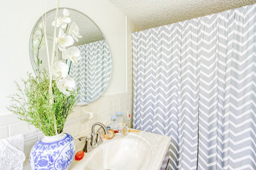 bathroom with decor and striped shower curtain