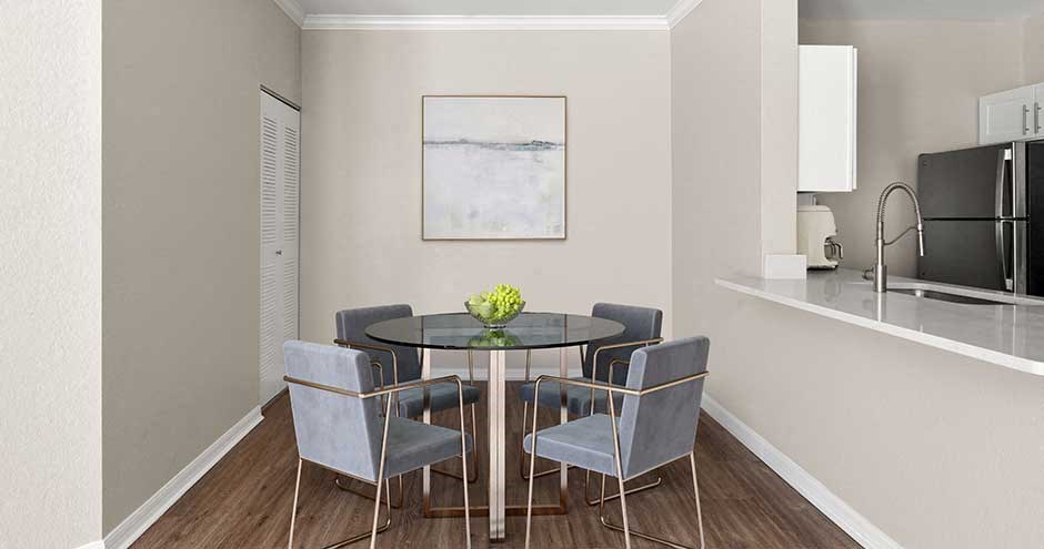 a dining room with a table and chairs