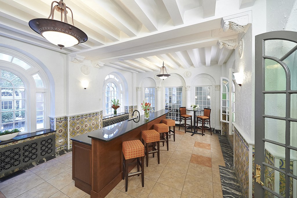 Spanish room with tile floor, long bar top with four chairs at Residences at Forest Park, Saint Louis, 63108
