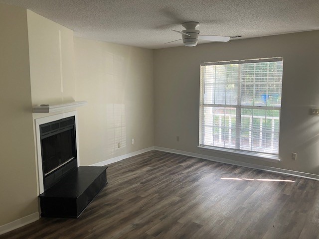 A room with a fireplace and a window.