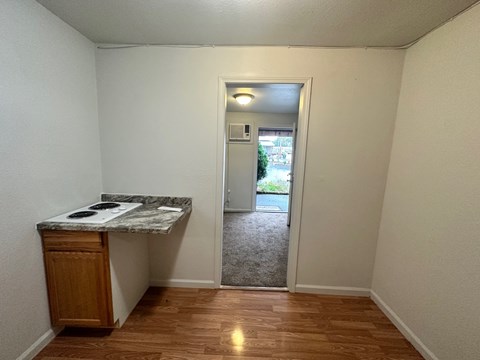 A kitchen area with a counter and a cabinet.