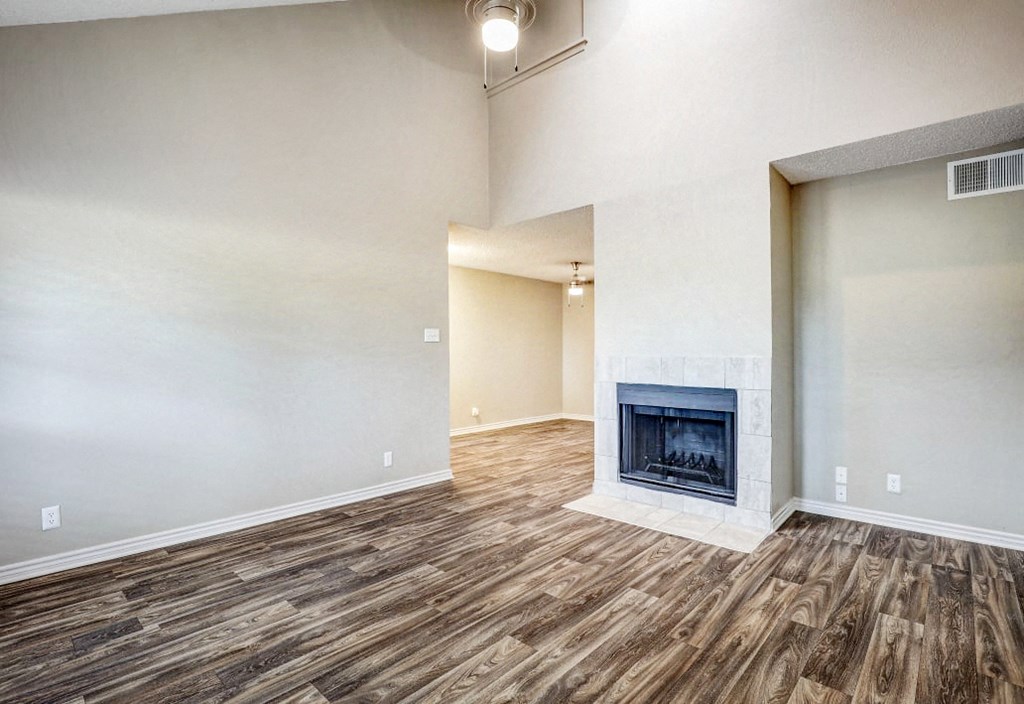 the living room of a new home with a fireplace