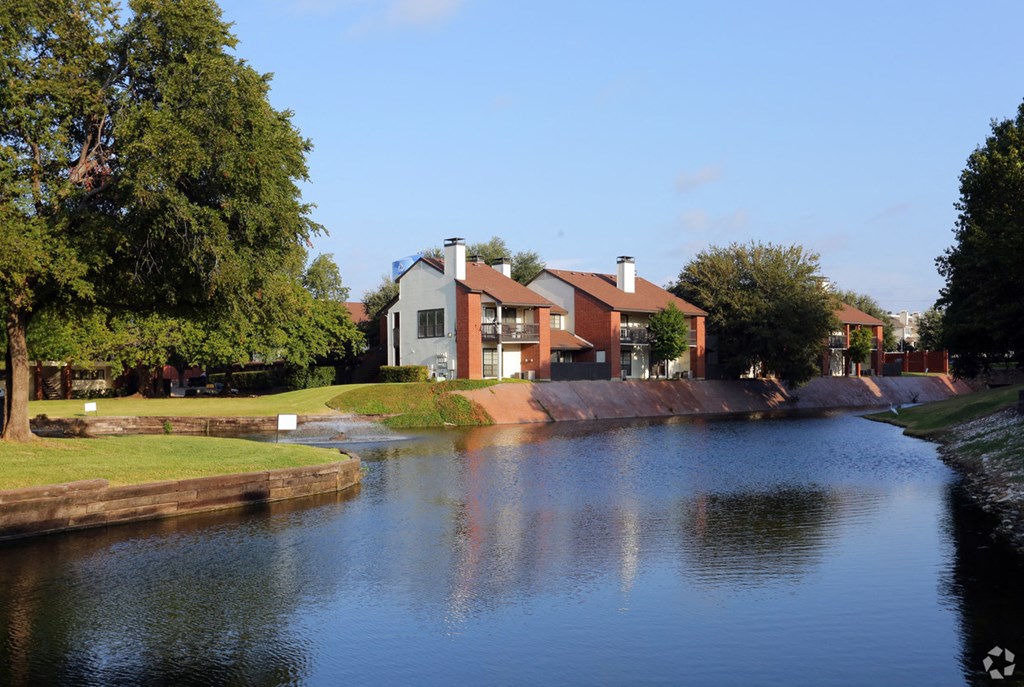 a house next to a body of water