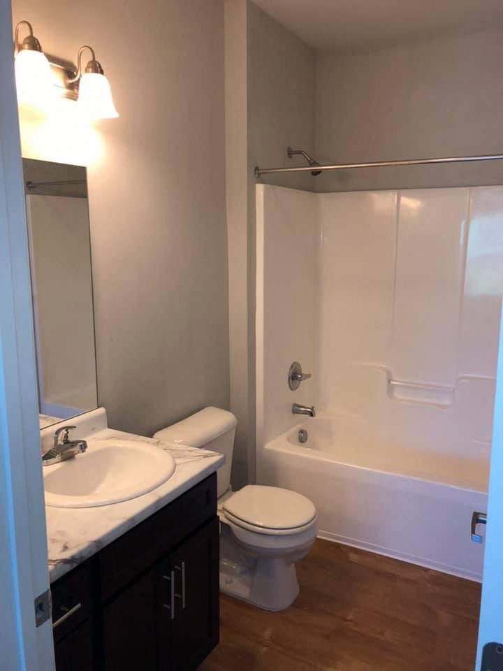 a bathroom with a sink toilet and a shower