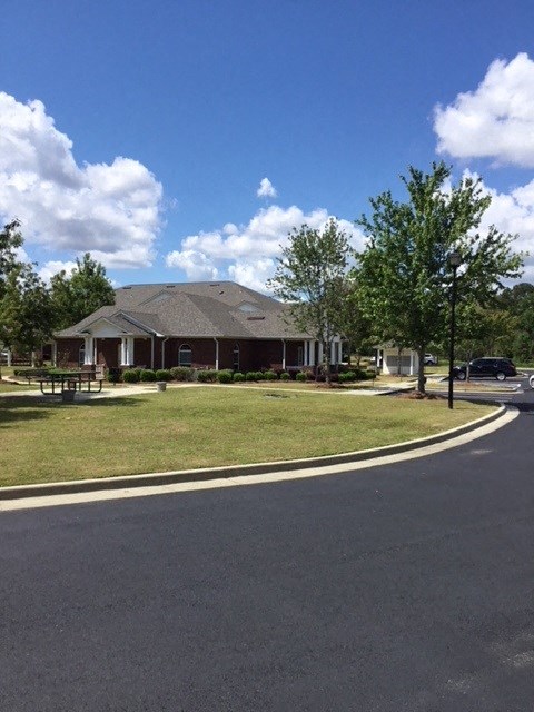 a house sitting on the corner of a street