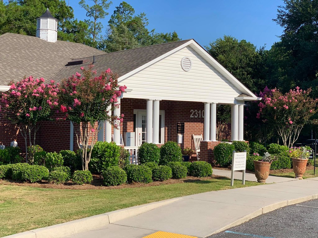 a house with a sign in front of it