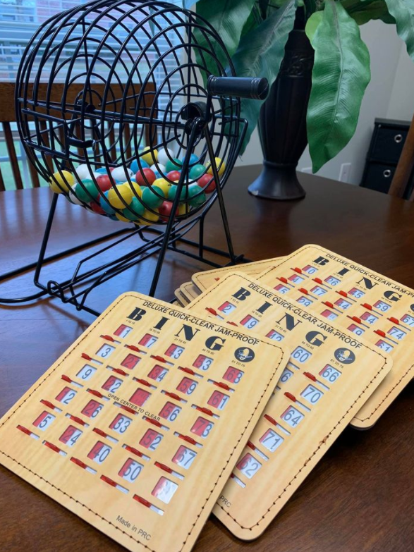 a game of bingo on a table next to a fan