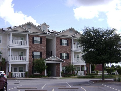 an apartment building on the corner of a street