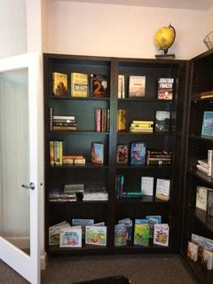 a book shelf in a room with a door