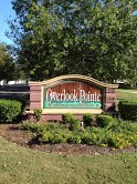 a sign for an arbor park in a park