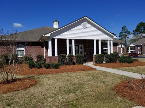 a house with a sidewalk in front of it