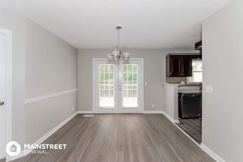 the living room and kitchen of a 560 sq ft home