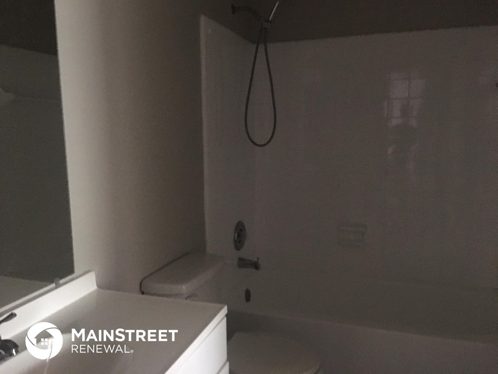 a small bathroom with a shower and a toilet