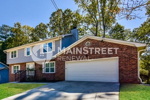 a brick house with a white garage door